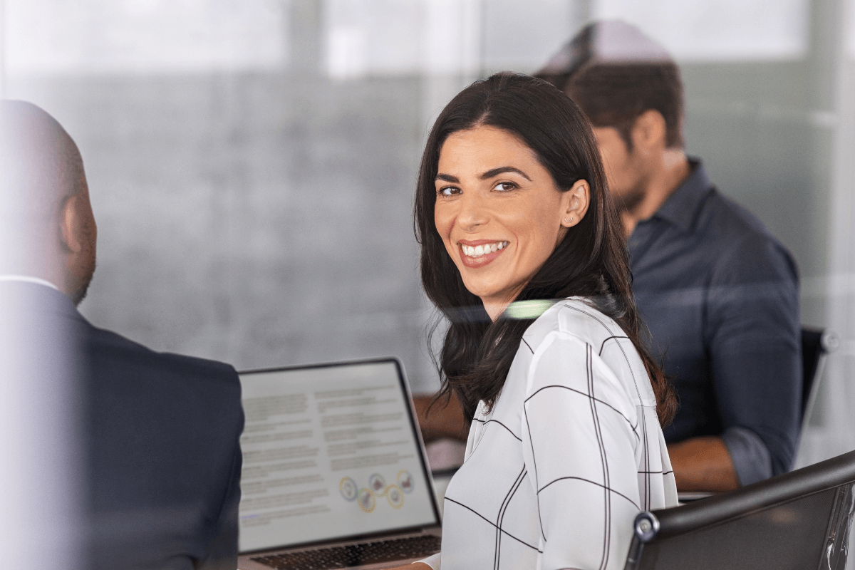 three young professionals in a conference room