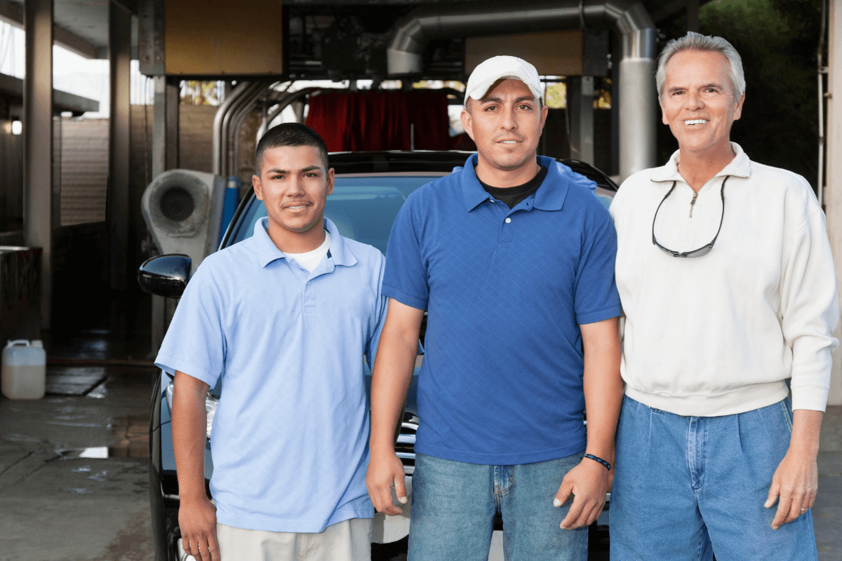 three young men standing shoulder to shoulder