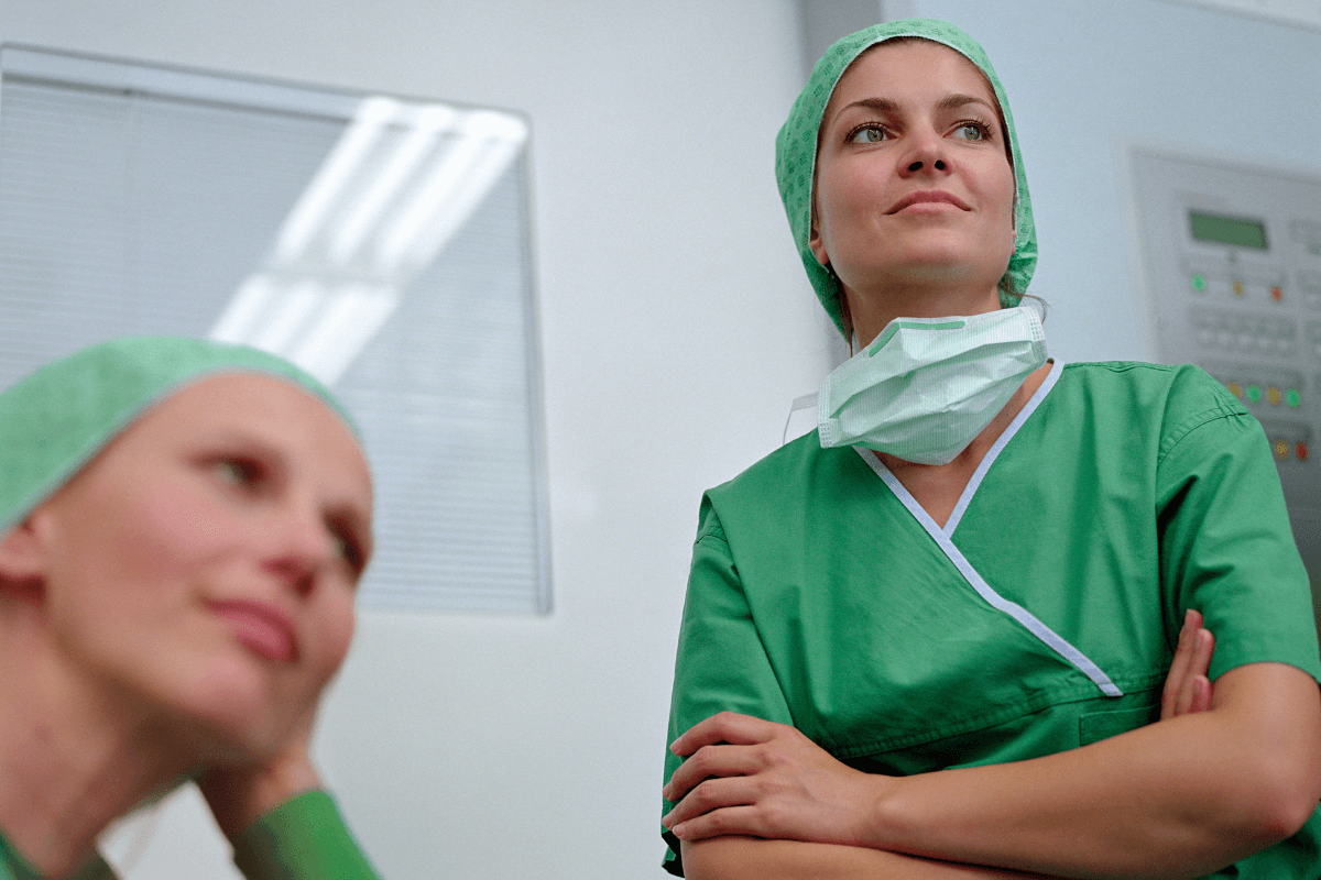 two female nurses in green scrubs